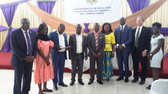 The Governor and Deputy Governor poses with the Winners of the Fintech Challenge 2017 -Salone Microfinace Trust in partnership with InvestED
